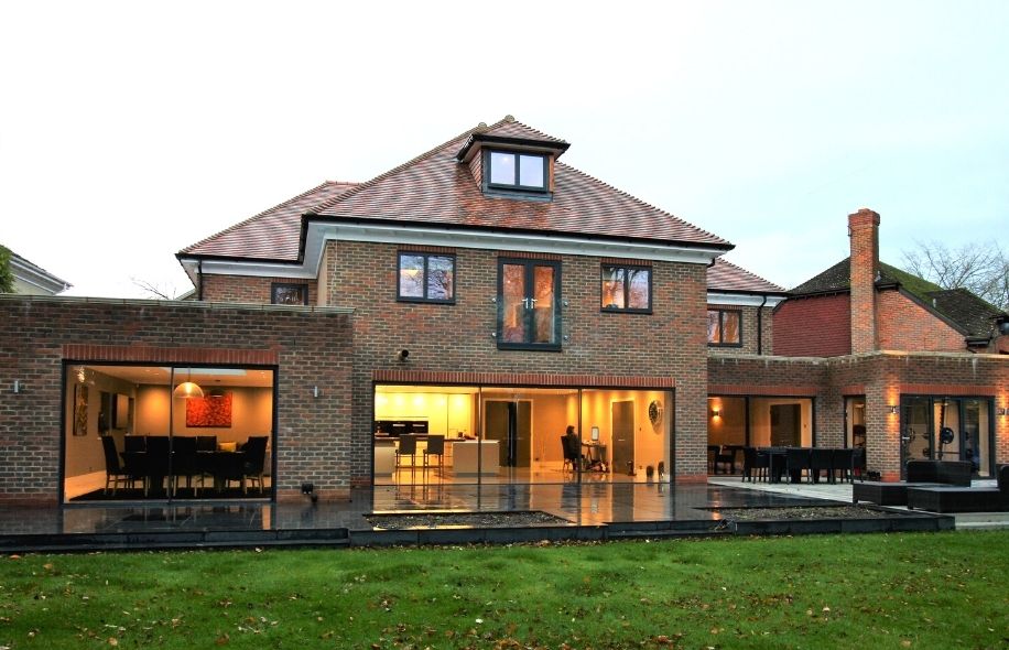 luxury new build home with a modern juliet balcony - slim sliding glass doors and aluminium casement window from sieger