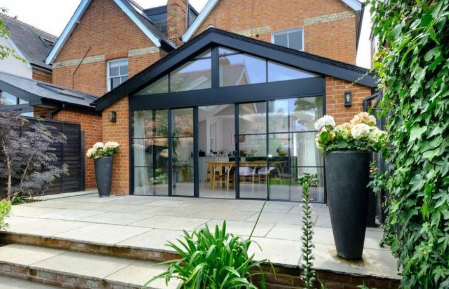 modern extension with gable end windows and steel look sieger slim sliding doors