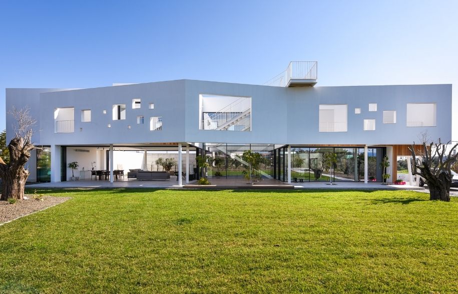 luxury modern villa in greece with cycladic architecture and sliding glass doors