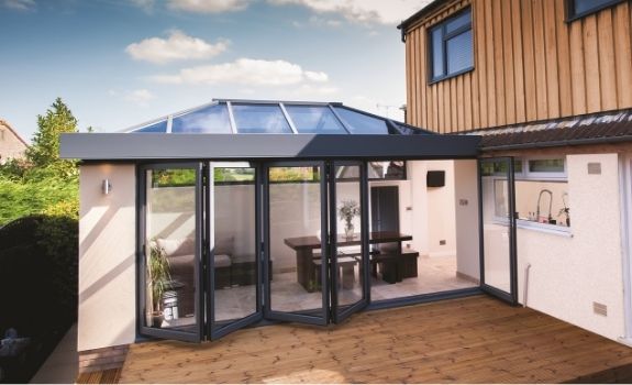 aluminium lantern rooflight above a four pane bifold door with a traffic door