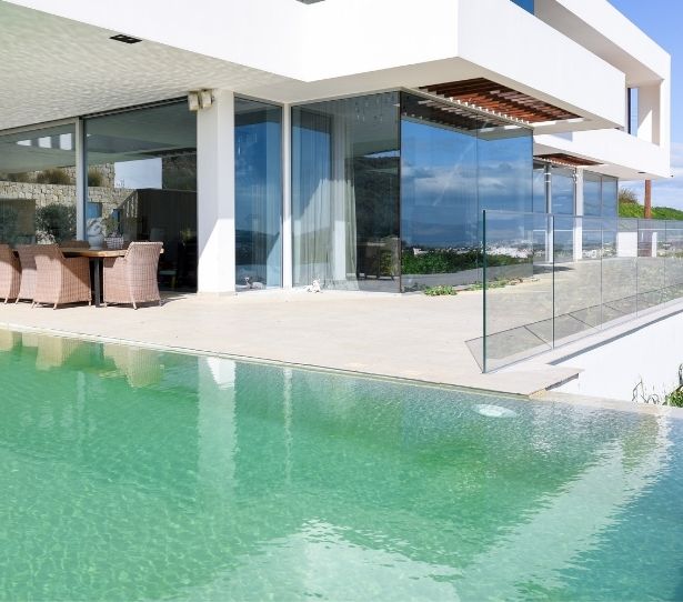 luxury modern villa house design - sliding glass doors and frameless glass balustrade
