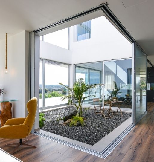 luxury modern villa house design - sliding glass doors and frameless glass balustrade