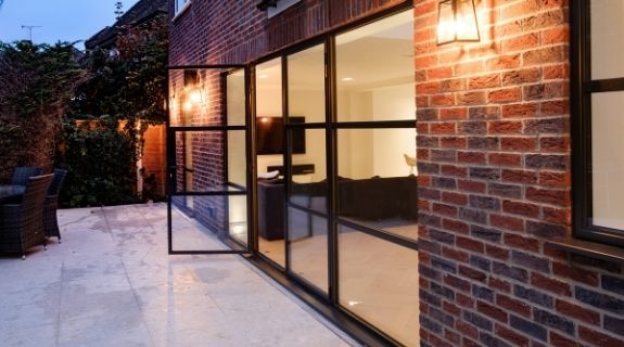 Sieger legacy casement door with sidelights and industrial style casement windows