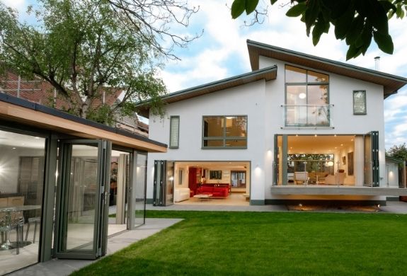 a full glazing package from sieger including grey framed aluminium bifold doors - casement windows - juliet balcony