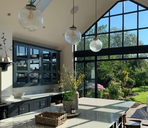 aluminium steel look glazing with sliding patio doors and gable end windows with glazing bars