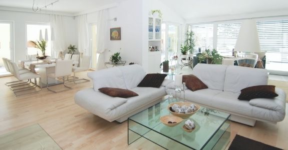 contemporary living room design with large windows and glass doors to maximise natural light