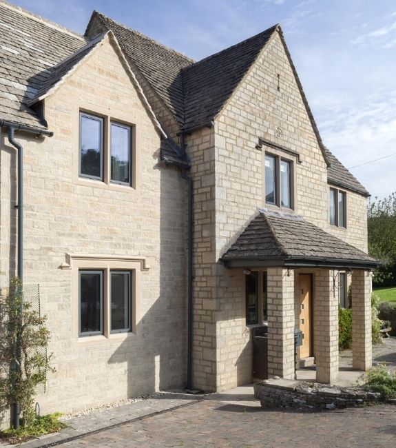 sieger legacy tilt and turn aluminium windows with grey frames on a traditional English country home