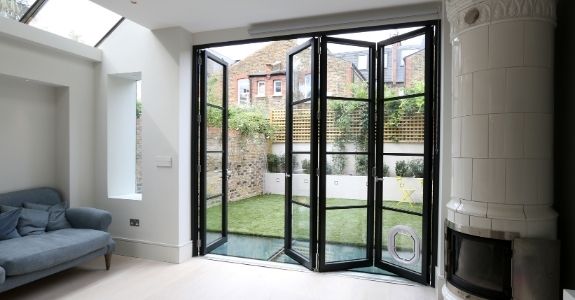 steel look sieger legacy bifold door with traffic door and cat flap