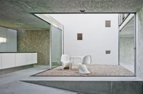 modern architecture style with open plan spaces and an internal courtyard and glass walls made form corner opening slim sliding glass doors