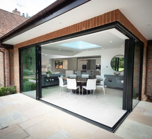 corner opening slim sliding glass doors on a contemporary home extension in Buckinghamshire