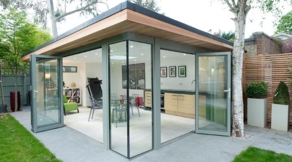 luxury garden room with grey framed aluminium bifold doors