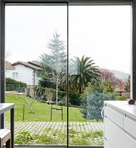 minimally framed aluminium two pane sliding door with ultra slim sightlines offering a clear uninterrupted view of the outdoors