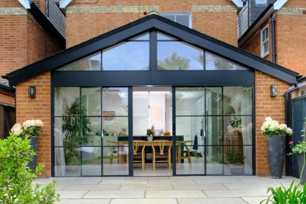 sieger slim sliding doors with applied glazing bars for a steel look aesthetic and gable end windows