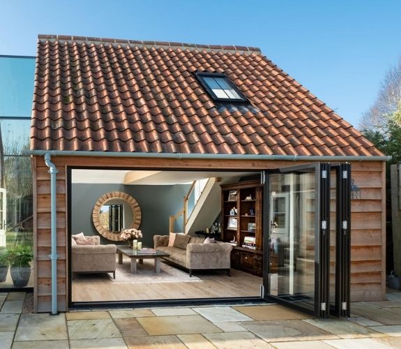 traditional style English countryside home with large bifolding doors with aluminium frames from sieger