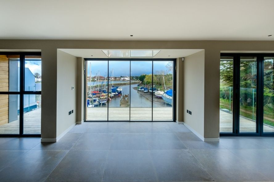 sieger aluminium bifold door and sieger slim framed sliding door with stunning waterfront views
