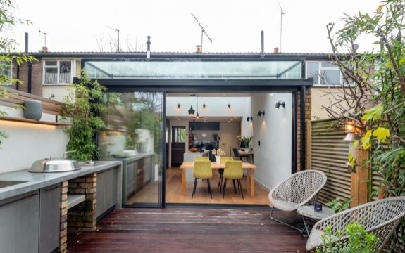 small glass extension using a slim sliding glass door and a box rooflight
