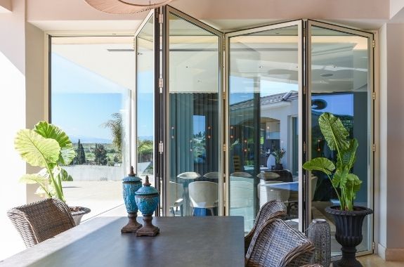 the slimmest aluminium bifold door used in a modern holiday villa design