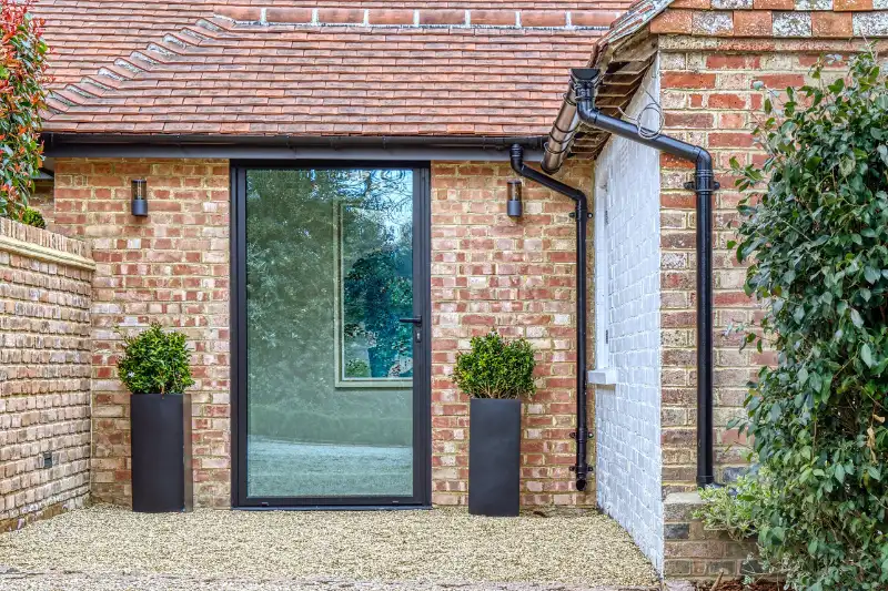 Sieger Lux Casement Door with slim aluminium framing and a large clear glass pane