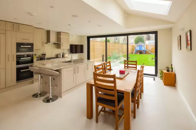 modern home extension with a three pane aluminium sliding patio door from Sieger