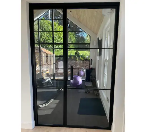 MIRO Hinge - an elegant internal glass casement door with a fixed sidelight