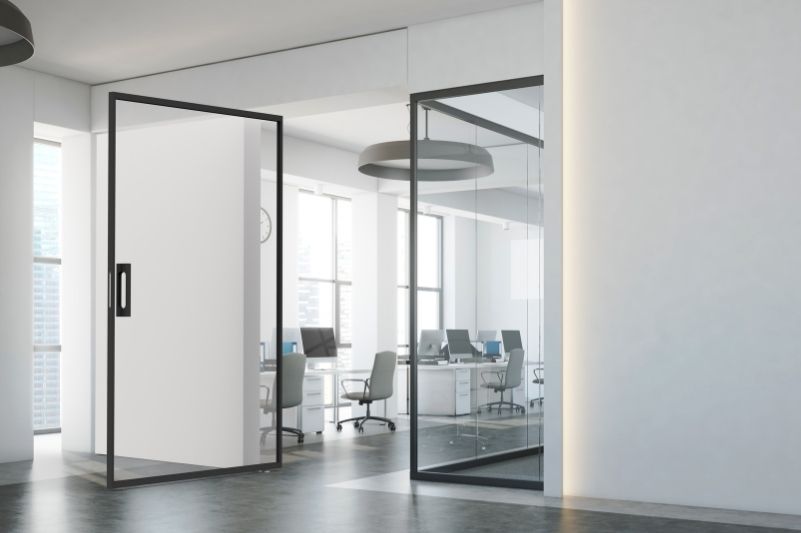 MIRO Pivot internal glass pivot door in a modern office space MIRO Pivot internal glass pivot door in a modern office space