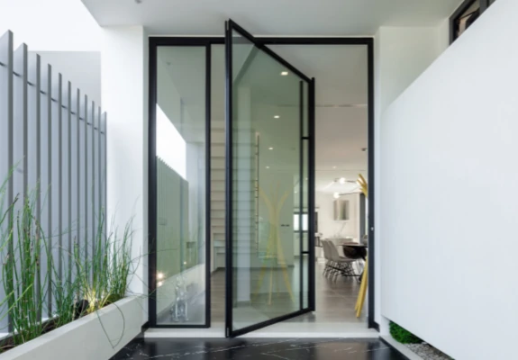 pivot door and fixed sidelights used to create a striking entrance that makes a statement